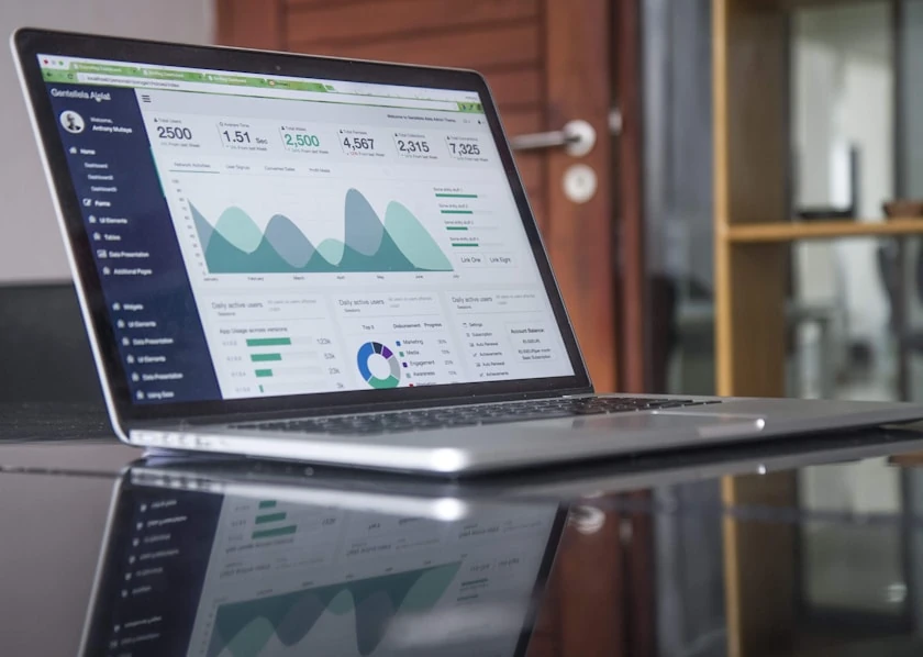 Laptop displaying website traffic and marketing performance charts